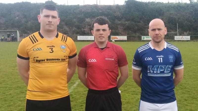 Team captains Ciaran Doherty and John O'Malley pictured with referee Martin McCormick