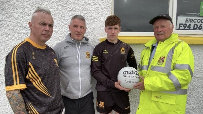 The late Marie Smyth's family sponsor match ball for Bundoran game with Naomh Muire