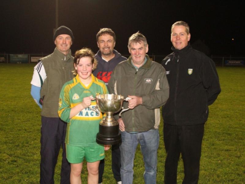 Frankie McGill presents the Kevin McGill Memorial Cup to winng captain Holly Gallagher after her team won the Ardara Under-12 Parish League Final.Also included are Under-12 coaches, Steven McKelvey, Patrck O'Shea and Pauric Brennan.(jmac.ie)