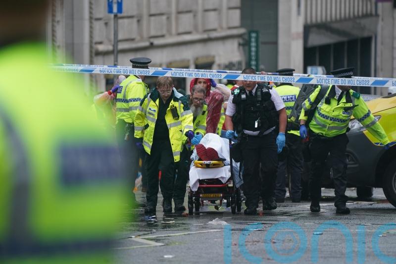 Man detained after car collides with pedestrians during Premier League parade