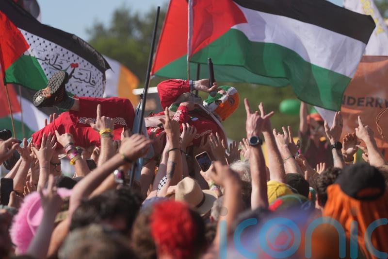 Kneecap and Brian Eno call on artists to join syndicate to support Palestine