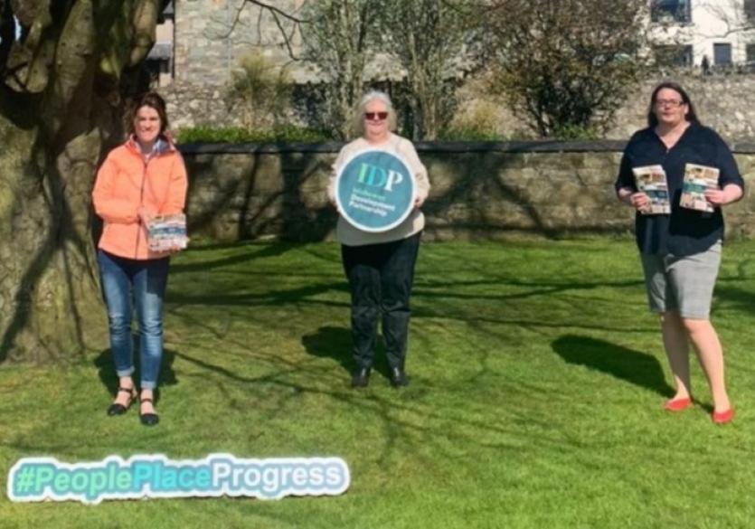 'Our Days and Nights' book being handed over to Buncrana Library (Photo L to R)  Sinead McLaughlin (Buncrana Library) Geraldine Holmes (IDP) and Trace